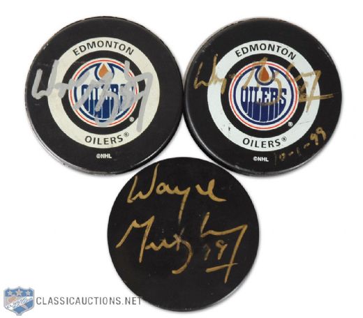 Stu Poiriers Wayne Gretzky Autographed Puck Collection of 3