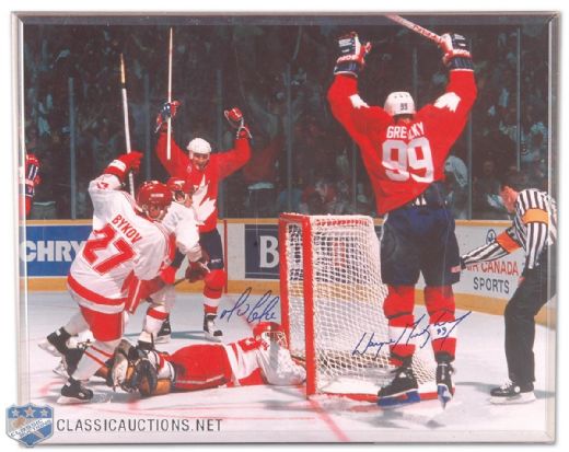Wayne Gretzky and Mario Lemieux Autographed 1987 Canada Cup Goal Celebration Photo, Plus Gretzky Signed Puck Collection of 5
