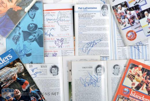 New York Islanders Signed Media Guide Collection of 18 Including Potvin, Trottier, Bossy, Smith, Gillies, LaFontaine, Arbour & Torrey