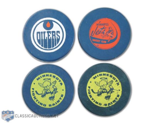 1972 Winnipeg Jets, Edmonton Oilers & Minnesota Fighting Saints (2) Blue Biltrite WHA Game Puck Collection of 4