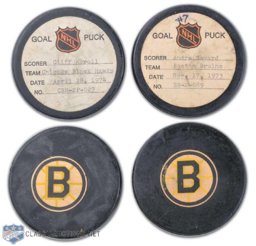 1973 & 1974 Andre Savard & Cliff Koroll Official NHL Goal Puck Collection of 2