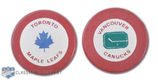 Mid-1970s Vancouver Canucks & Toronto Maple Leafs Red Biltrite Puck Collection of 2