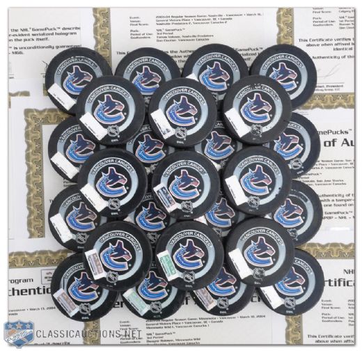 2003-04 Vancouver Canucks Collection of 25 Game-Used Pucks with NHL GamePucks Program LOAs 