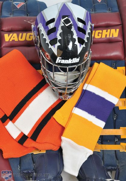 Assorted Game-Worn/Game-Issued NHL Pants, Socks, Helmets and Goalie Pads Collection of 12