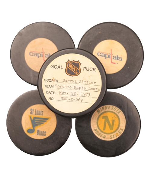 Darryl Sittlers Toronto Maple Leafs November 22nd 1973 Goal Puck from the NHL Goal Puck Program Plus 1973-83 Viceroy NHL Game Pucks (4)