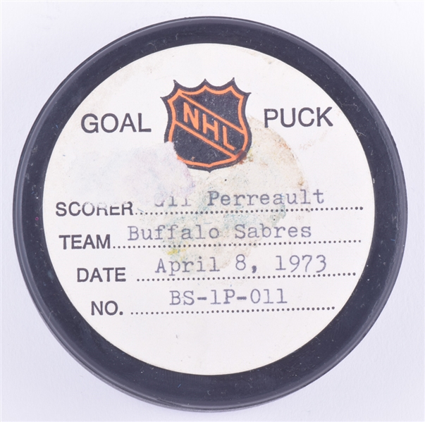 Gilbert Perreaults Buffalo Sabres April 8th 1973 Playoff Goal Puck from the NHL Goal Puck Program - 3rd Playoff Goal of Season / Career Playoff Goal #3 - Last Playoff Goal of the Season for Perreault