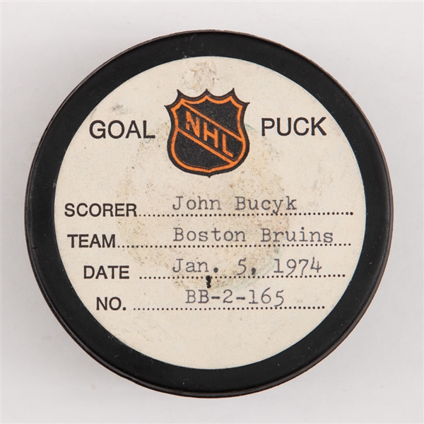 Johnny Bucyks Boston Bruins January 5th 1974 Goal Puck from the NHL Goal Puck Program - Season Goal #13 of 31 / Career Goal #448 of 556 - 3rd Goal of Hat Trick - Assisted by Esposito