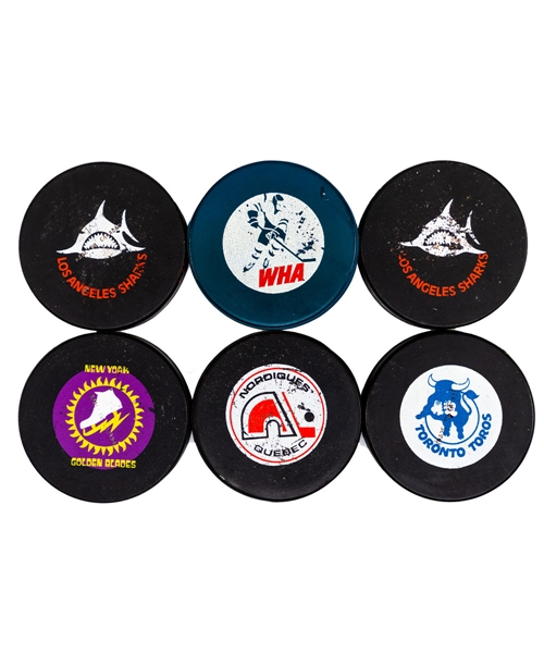 1970s WHA Game Puck and Souvenir Puck Collection of 11 Including Biltrite and Art Ross Pucks