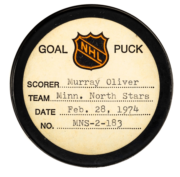 Murray Olivers Minnesota North Stars February 28th 1974 Goal Puck from the NHL Goal Puck Program - Season Goal #12 of 17 / Career Goal #250 of 274