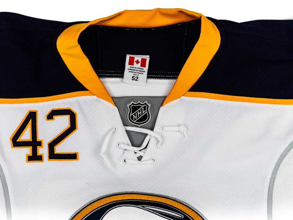 Nathan Gerbe Game Worn Buffalo Sabres Road Jersey. Serial: 7365. Set 1 -  Size 52. 2012-13 season. - NHL Auctions