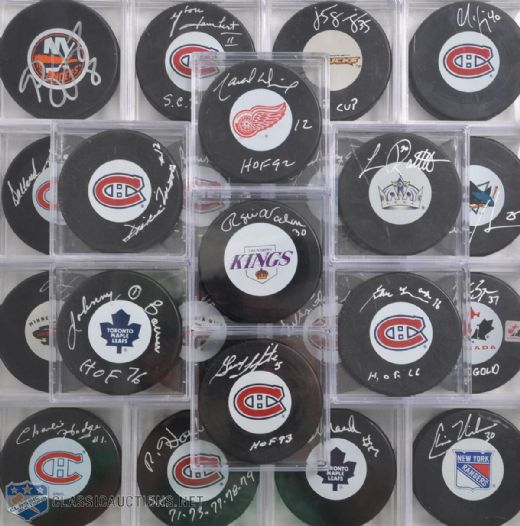 NHL Past and Present Stars Signed Hockey Puck Collection of 26, Including 7 HOFers!