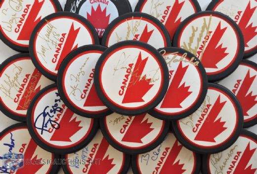 Team Canada 1972 Series and 1976 Canada Cup Signed Puck Collection of 23