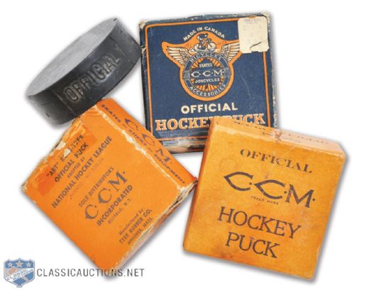 Collection of Vintage CCM Hockey Pucks (4) with Three in Original Boxes