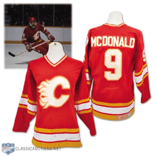 Lanny McDonalds 1983-84 Calgary Flames Game-Worn Jersey with Centennial Patch - Nice Game Wear and Team Repairs!