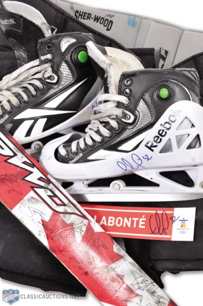 Charline Labontes 2010 Winter Olympics Skates, Pants and Team-Signed Stick Plus Signed Locker Nameplate