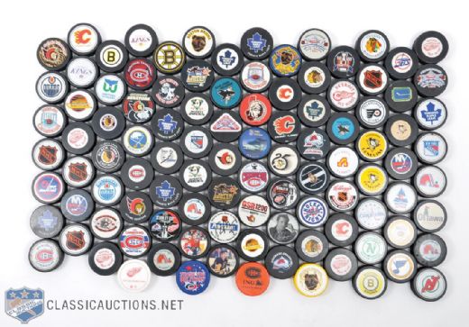 Collection of 100+ NHL Souvenir Pucks