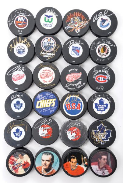 Collection of 24 Signed Pucks with Maurice Richard, Gordie Howe, Lafleur and Others 