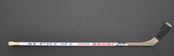 Mike Eruziones Signed Bauer Hockey Stick with "1980 Gold" Inscription Plus 1980 Lake Placid Hockey Pucks (2) and Patch