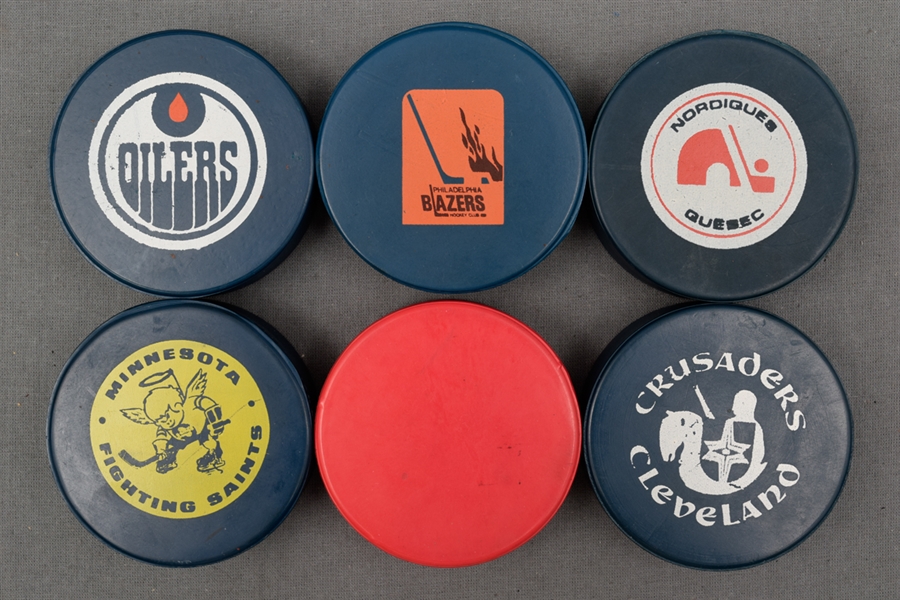 WHA Game Puck Collection of 6 Featuring 5 Blue Pucks
