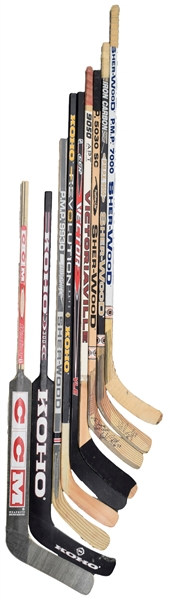 Game-Used, Game-Issued and Other Hockey Stick Collection of 9 with Bourque, Coffey and MacInnis Game-Used Sticks
