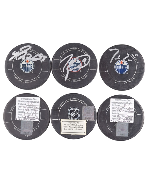 Edmonton Oilers Signed Goal Pucks with Team LOAs; Nugent-Hopkins (15th Goal of 2011-12), Eberles (27th Goal of 2011-12) and Halls (1st Career Overtime Game-Winning Goal from 2010-11)