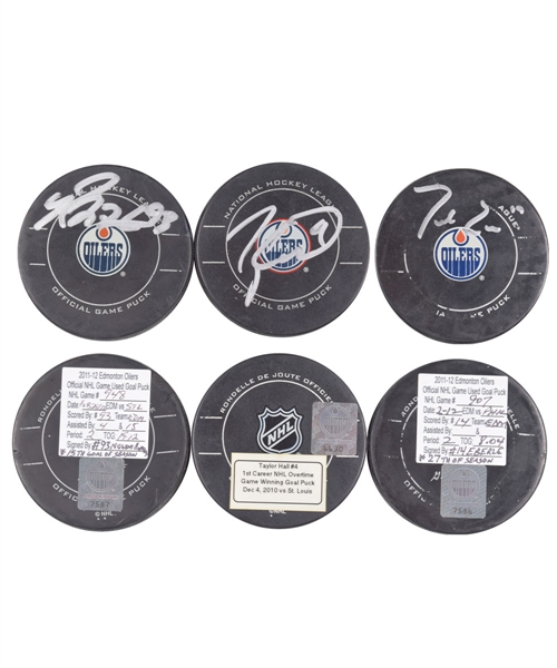 Edmonton Oilers Signed Goal Pucks with Team LOAs; Nugent-Hopkins (15th Goal of 2011-12), Eberles (27th Goal of 2011-12) and Halls (1st Career Overtime Game-Winning Goal from 2010-11)