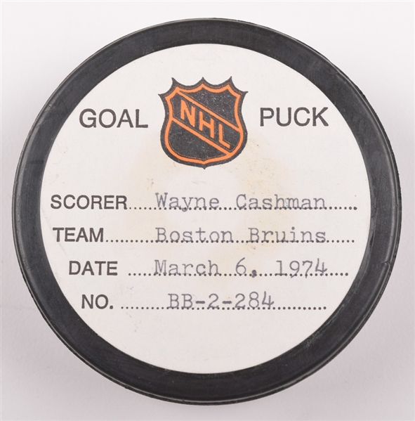 Wayne Cashmans Boston Bruins March 6th 1974 Goal Puck from the NHL Goal Puck Program - 20th Goal of Season / Career Goal #110 / 2nd Goal of Hat Trick