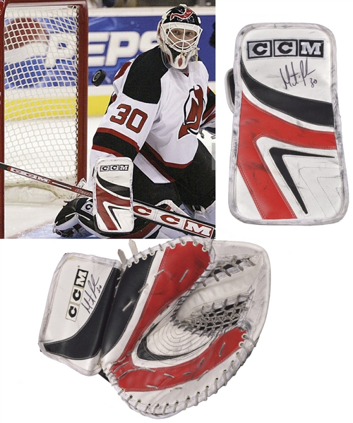 Martin Brodeurs 2003-04 New Jersey Devils Signed CCM Game-Used Photo-Matched Blocker Plus Circa 2003-04 CCM Glove - Vezina and William M. Jennings Trophies Season!