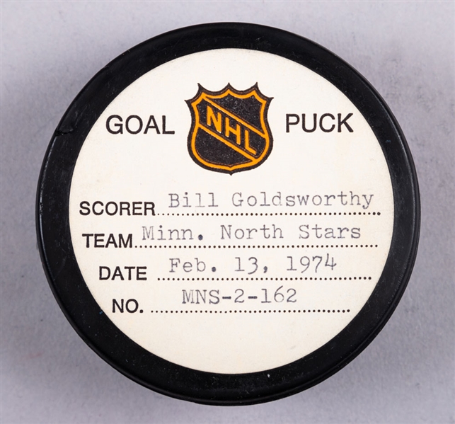 Bill Goldsworthy’s Minnesota North Stars February 13th 1974 Goal Puck from the NHL Goal Puck Program - Season Goal #30 of 48 / Career Goal #192 of 283 - Game-Tying Goal