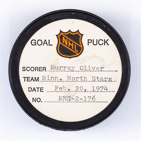 Murray Olivers Minnesota North Stars February 20th 1974 Goal Puck from the NHL Goal Puck Program - Season Goal #11 of 17 / Career Goal #249 of 274