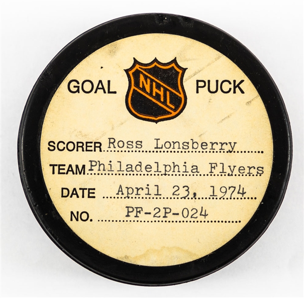 Ross Lonsberrys Philadelphia Flyers April 23rd 1974 Playoff Goal Puck from the NHL Goal Puck Program – Season Playoff Goal #2 of 4 / Career PO Goal #6 of 21 – Game Winning Goal 