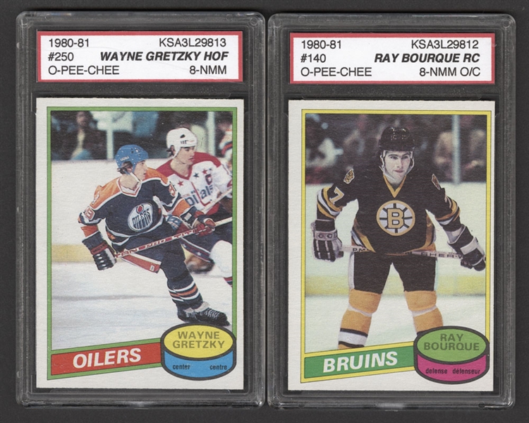 1980-81 O-Pee-Chee Hockey Card #250 HOFer Wayne Gretzky (Graded KSA 8) and 1980-81 O-Pee-Chee Hockey Card #140 HOFer Raymond Bourque Rookie (Graded KSA 8 O/C)