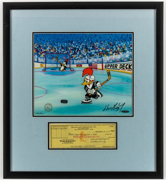 Woody Woodpecker and Chilly Willy "Slapshot Woody" Limited-Edition Hand Painted Cel Framed Display #242/250 Signed by Wayne Gretzky (UDA COA) Mounted with Walter Lantz Signed Check (19 ½” x 21 ½”) 