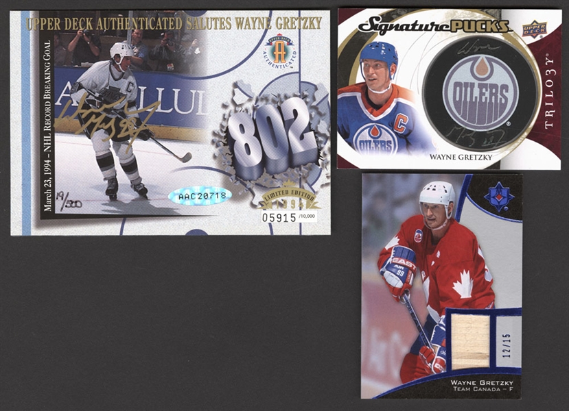 Wayne Gretzky Hockey Cards (5) Including 2015-16 UD Trilogy Signature Pucks #SP-WG, 2015-16 Upper Deck Ultimate #1 (12/15) and 1994 Upper Deck Signed 802 Oversized Card (19/500 - UDA Authenticated)