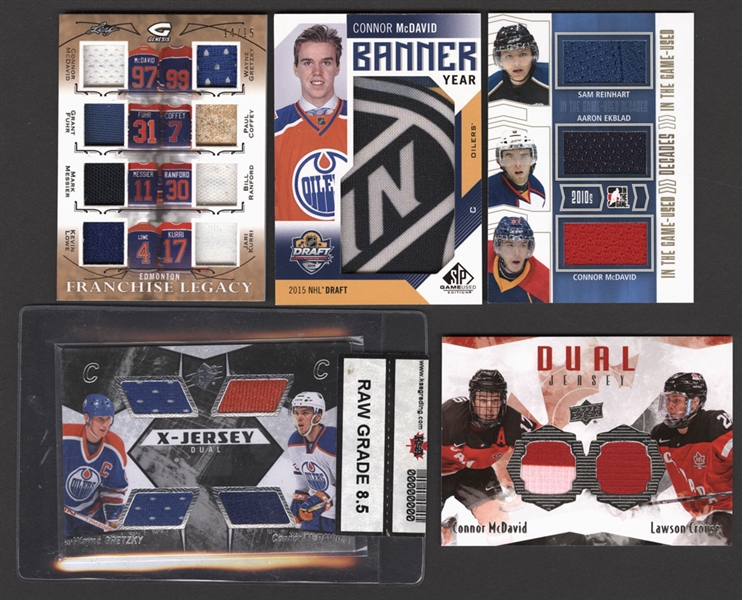 Connor McDavid Card Collection (5) Including 2015-16 Leaf Genesis Franchise Legacy Bronze #FL-10 McDavid/Gretzky (14/15) and 2014-15 ITG Decades Game-Used Gold Version #D-01 McDavid/Reinhart/Ekblad
