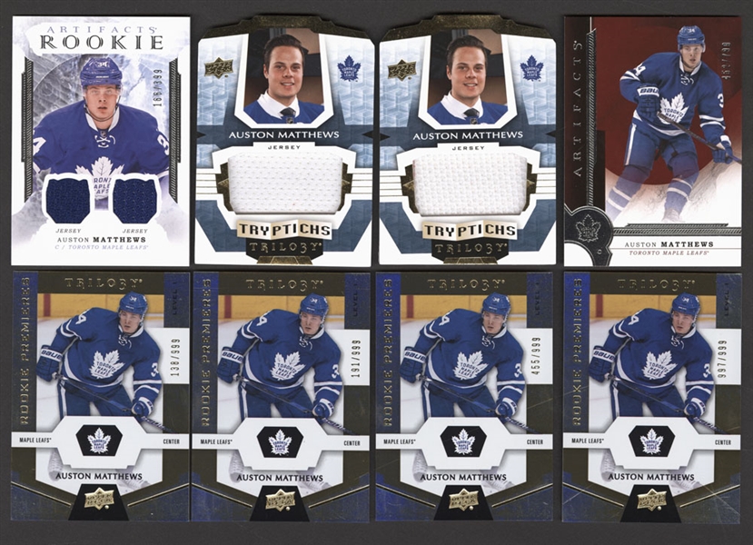 Auston Matthews Hockey Cards (12) Including 2016-17 SP Game Used Rookie Sweaters #RS-AM (211/499) and 2016-17 UD Artifacts Rookie Dual Jersey Relics Silver (166/399)
