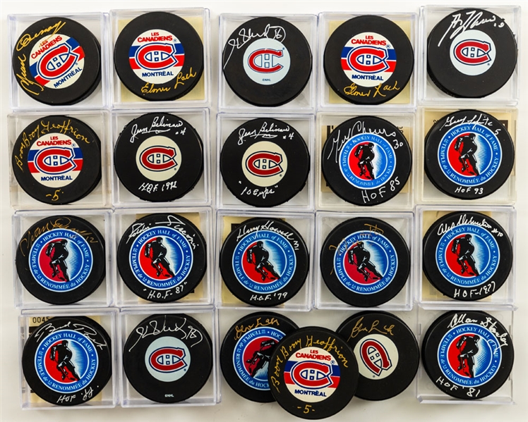 Montreal Canadiens and Hockey Hall of Fame Signed Pucks (21) Including Geoffrion, Beliveau, H. Richard, Lach, Lafleur and Others