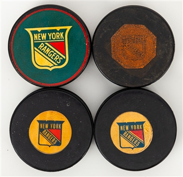 Vintage Hockey Pucks (7) Including New York Rangers Official Game Pucks (3) and Cosby Souvenir Puck