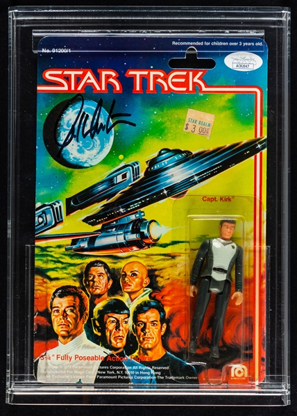 William Shatner Signed Star Trek Uniform Shirt (Beckett Certified) and Signed 1979 Mego Star Trek Captain Kirk Action Figurine in Original Packaging (JSA Certified)