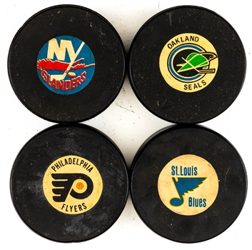 NHL and WHA Game Puck and Souvenir Puck Collection of 47 Including 1969-77 NHL Art Ross/Converse (Screened Reverse) Game Pucks (4) and 1973-83 NHL Viceroy Game Pucks (21)