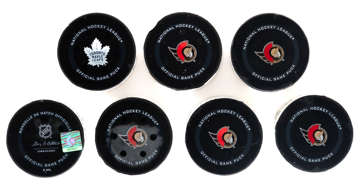 Montreal Canadiens, Boston Bruins and Pittsburgh Penguins 2021-22 Game-Used Goal Puck Collection of 7 Including Nick Suzuki and Others - All With COAs!