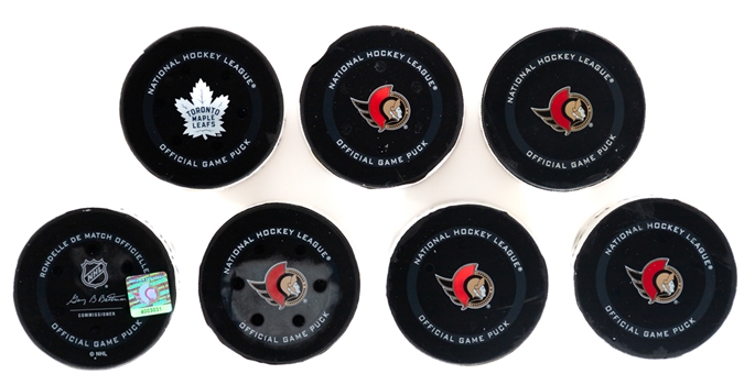 Montreal Canadiens, Boston Bruins and Pittsburgh Penguins 2021-22 Game-Used Goal Puck Collection of 7 Including Nick Suzuki and Others - All With COAs!