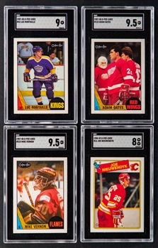 1987-88 and 1988-89 O-Pee-Chee SGC-Graded Rookie Cards (4) Including 1987-88 #42 HOFer Luc Robitaille (SGC 9), 1987-88 #123 HOFer Adam Oates (SGC 9.5) and 1987-88 #215 HOFer Mike Vernon (SGC 9.5)