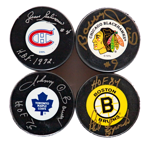 Autographed Hockey Puck Collection of 4 Including HOFers Jean Beliveau, Johnny Bower, Bobby Hull and Phil Esposito with Steiner Lighted Puck Display Cases (4)