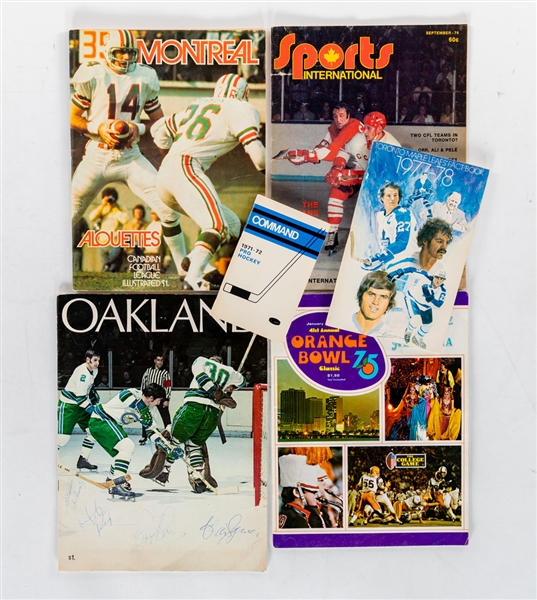 1960s to 1980s Mixed Sports Publication Collection (22) including 1975 Orange Bowl Program, 1977-78 Toronto Maple Leafs Media Guide and Multi-Signed 1969-70 Oakland Seals Magazine with Jacques Plante