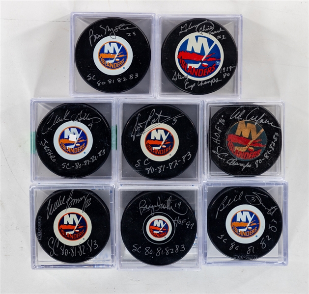 New York Islanders "1980s Islanders" Signed Puck Collection of 8 Including HOFers Bossy, Gillies, Potvin, Smith, Trottier and Arbour - All Inscribed! - Most with COAs!
