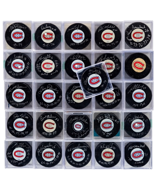 Montreal Canadiens "1970s Canadiens" Signed Puck Collection of 25 Including HOFers Lafleur, Savard, Mahovlich, Bowman, Lemaire, Shutt, Gainey, Robinson, Lapointe and Langway - All inscribed!